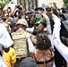 Cal Guard's 79th Infantry Brigade Combat Team Chaplain prays with protesters