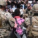 Cal Guard's 79th Infantry Brigade Combat Team Captain kneels with protesters in support