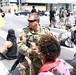 Cal Guard's 79th Infantry Brigade Combat Team Captain kneels with protesters in support