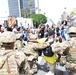 Cal Guard's 79th Infantry Brigade Combat Team kneels with protesters in support