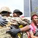 Cal Guard's 79th Infantry Brigade Combat Team Chaplain prays with protesters