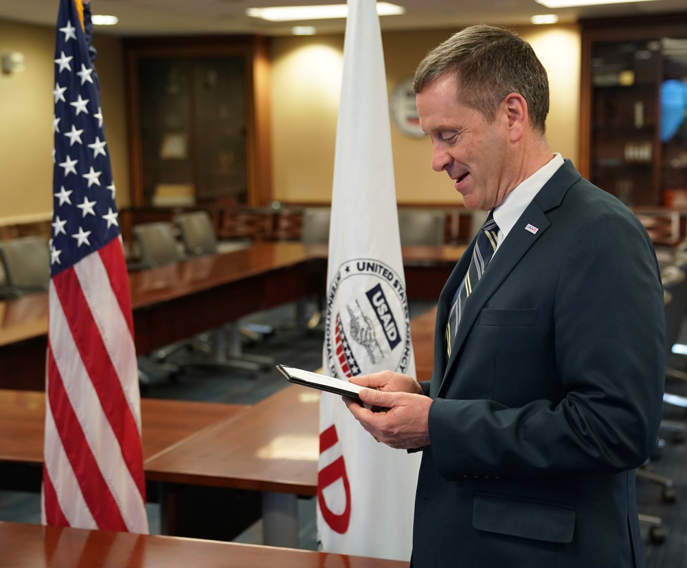 AAID Mark Green virtually signs in Chris Cushing as USAID Haiti Mission Director