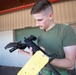 Spray, Scrub, Repeat - U.S. Marines prepare weapons for exercises