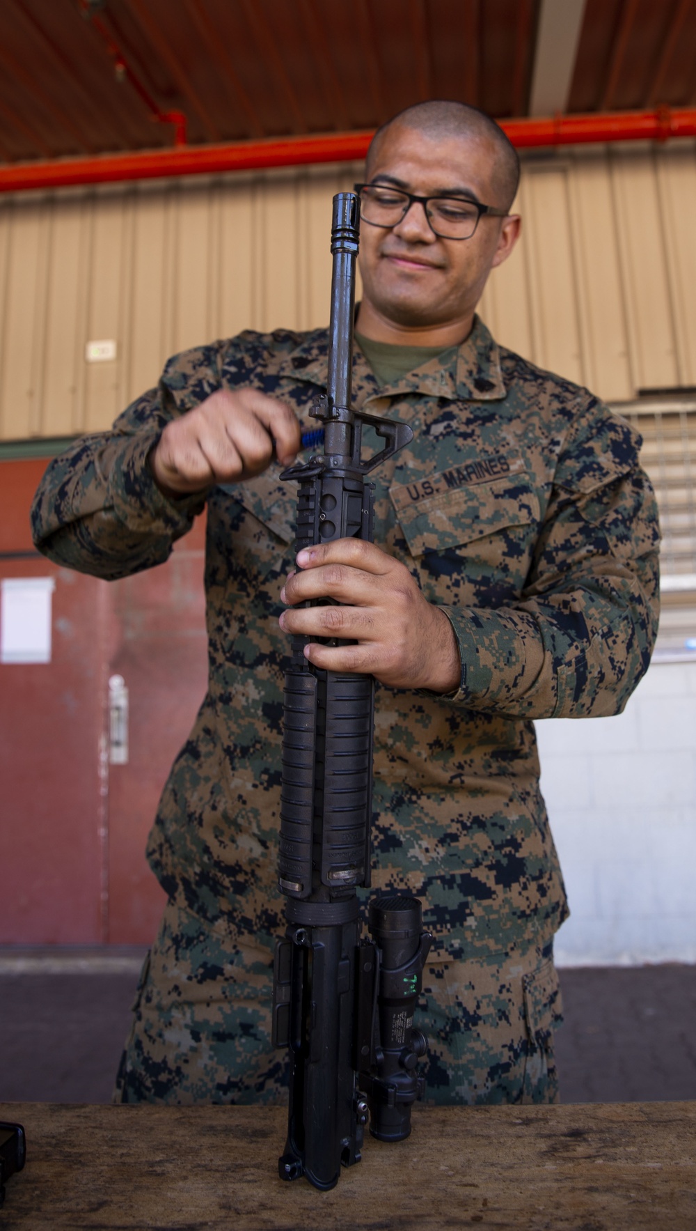 U.S. Marines clean rifles to prepare for upcoming exercises