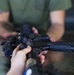 U.S. Marines clean rifles to prepare for upcoming exercises