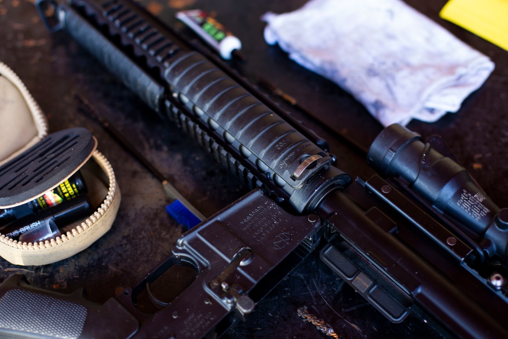 U.S. Marines clean rifles to prepare for upcoming exercises