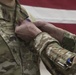 Brig. Gen. Stephen Jost presents the Purple Heart Medal to Chief Warrant Officer 2 Thomas Caudill