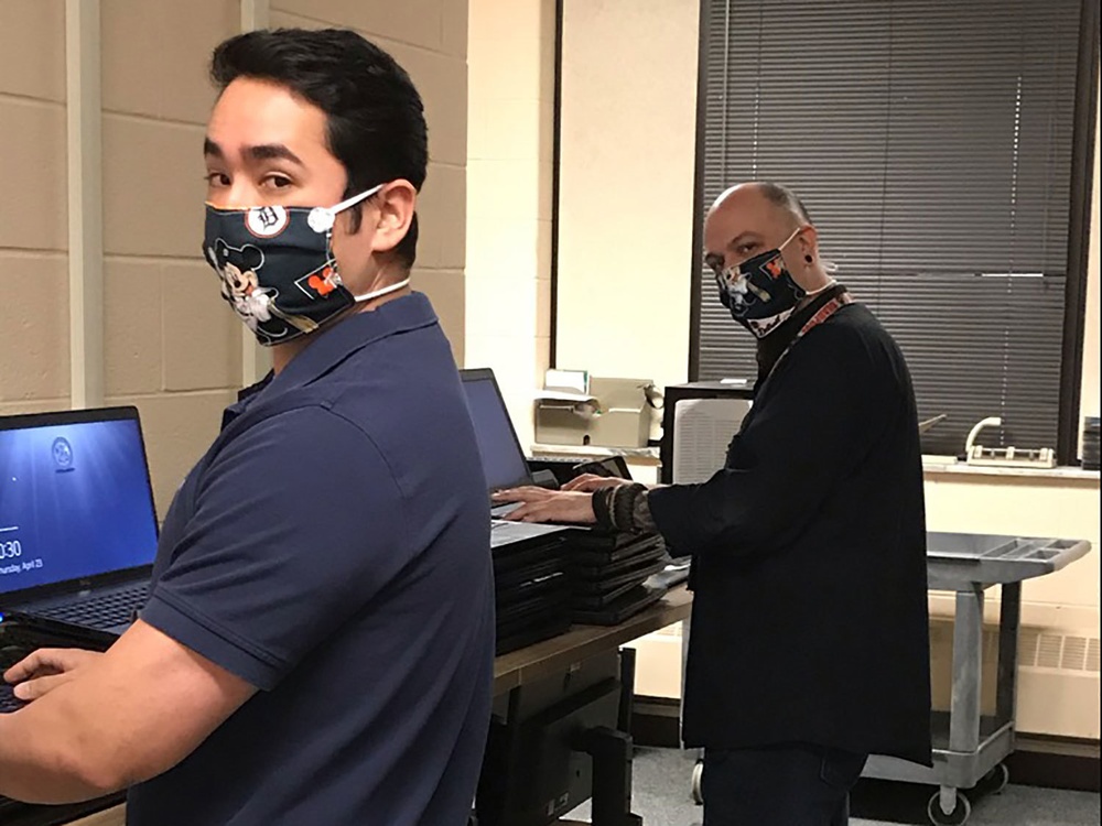 Tank-automotive and Armaments Command employees wear face masks to combat COVID-19