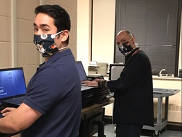 Tank-automotive and Armaments Command employees wear face masks to combat COVID-19