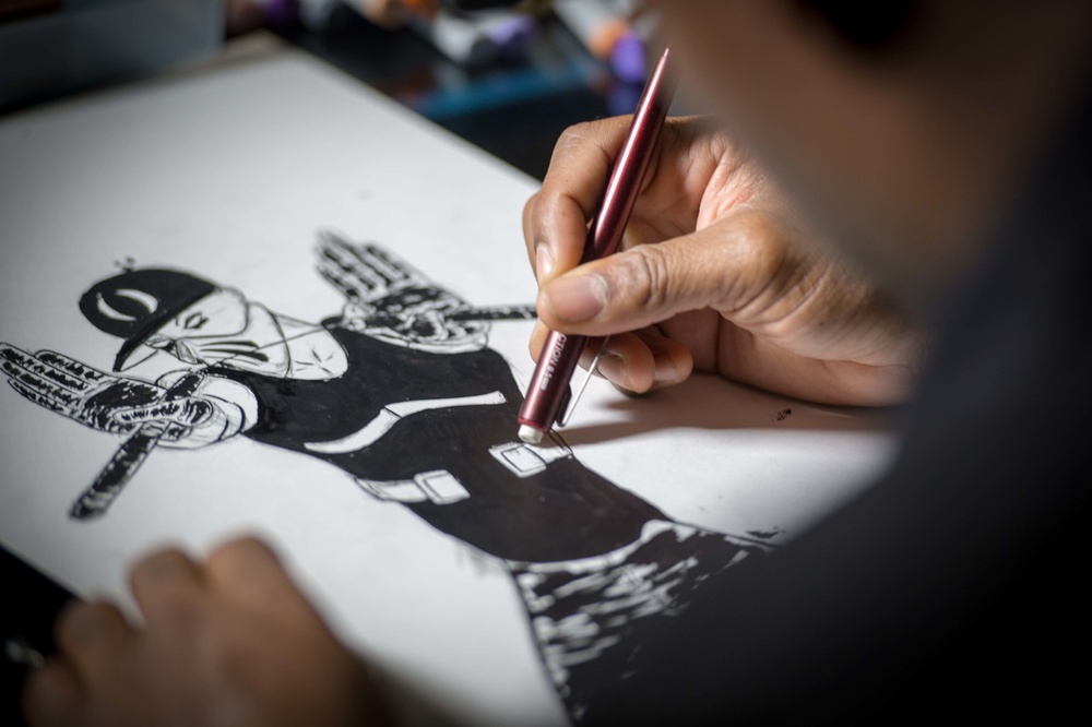 USS Carl Vinson (CVN 70) Sailor Creates Comic Book Art