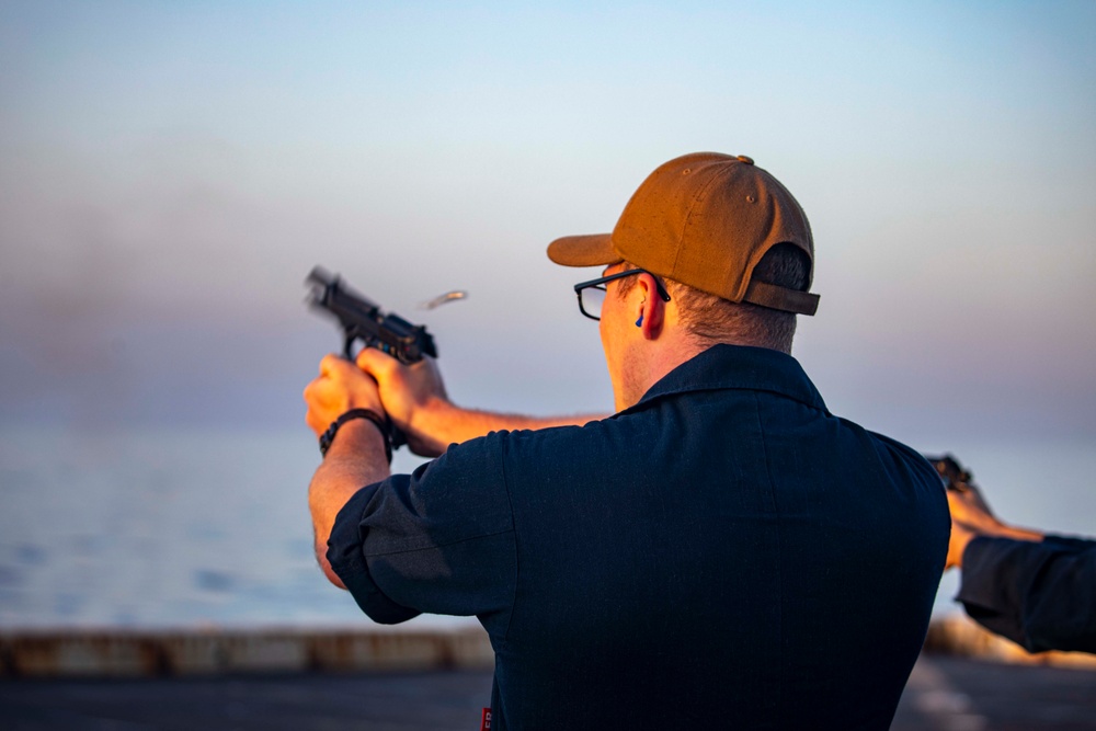 Sailors take part in a weapons qualification