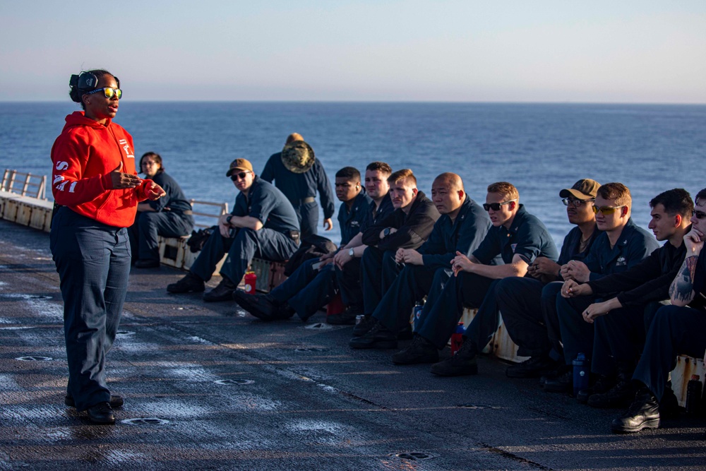 Sailors take part in a weapons qualification
