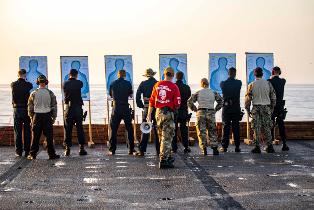 Sailors take part in a weapons qualification
