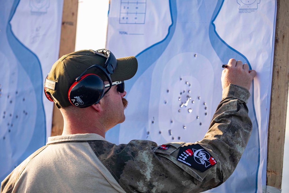 Sailors take part in a weapons qualification