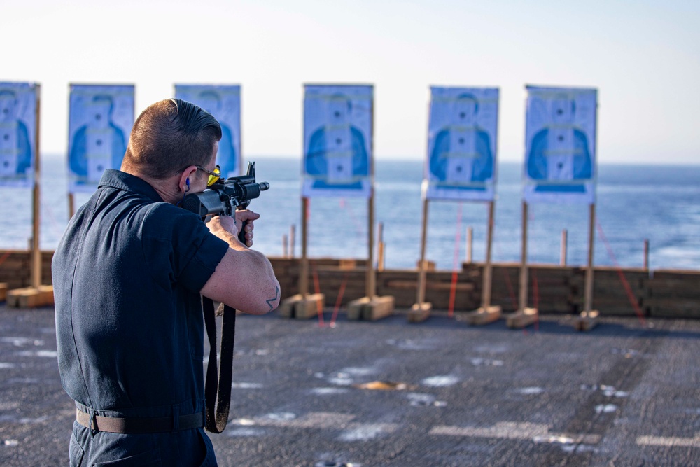 Sailors take part in a weapons qualification