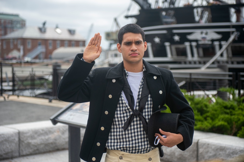 Culinary Specialist 3rd Class Abdon Vivastejada recites the naturalization oath