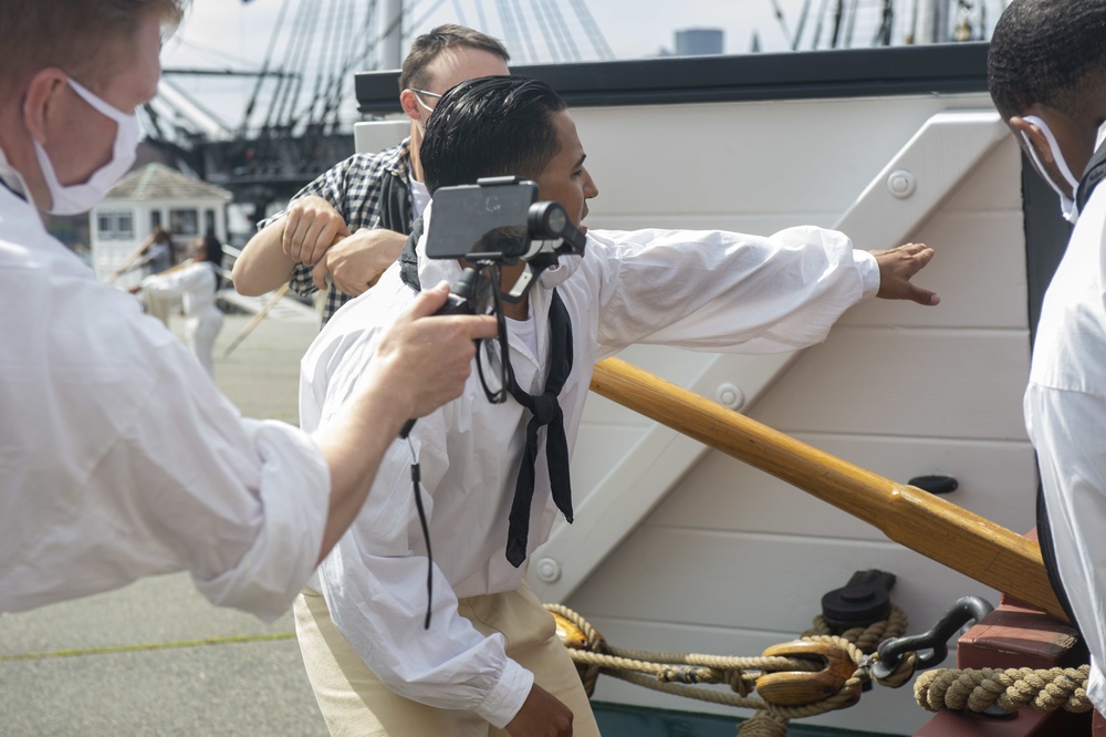 Sailors perform a gun drill for Facebook Live