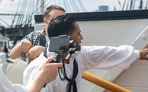 Sailors perform a gun drill for Facebook Live