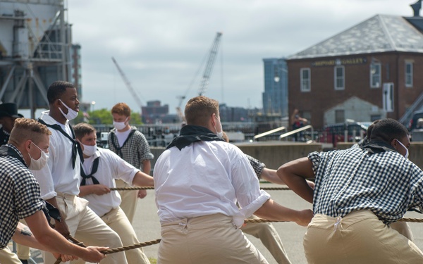 Sailors perform a gun drill for Facebook Live