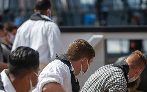 Sailors demonstrate gun drills for Facebook Live