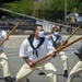 Sailors demonstrate pike drills for Facebook Live