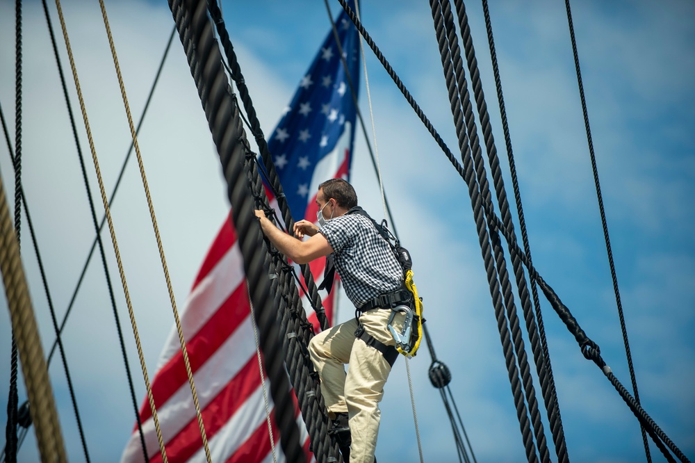 Seaman Nathaniel Roth climbs aloft for the fourth of July Facebook Live celebration