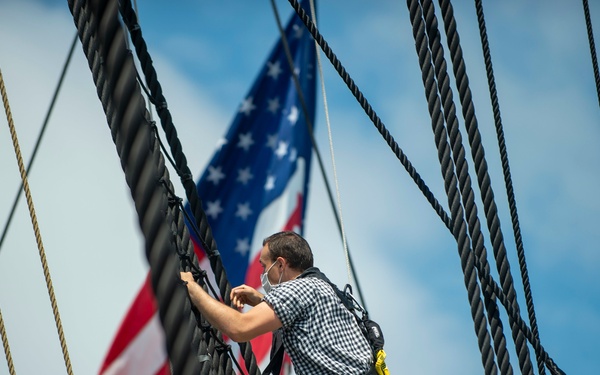 Seaman Nathaniel Roth climbs aloft for the fourth of July Facebook Live celebration