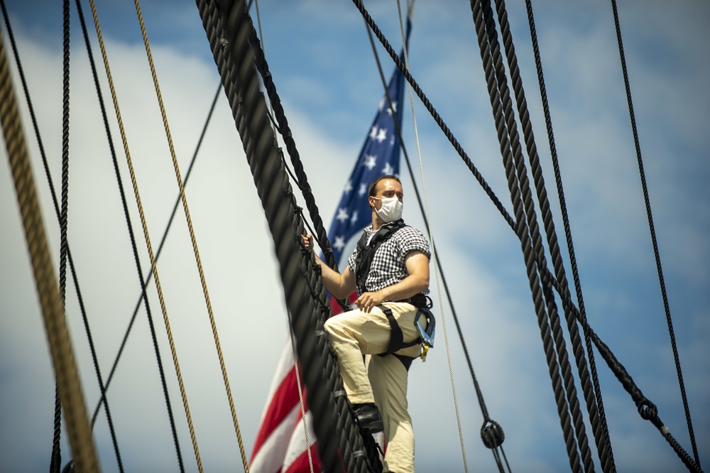 Seaman Nathaniel Roth climbs aloft for the fourth of July Facebook Live celebration