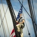 Seaman Nathaniel Roth climbs aloft for the fourth of July Facebook Live celebration