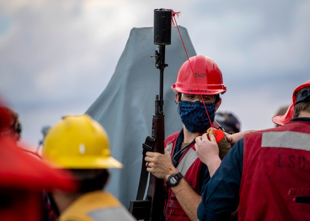 Sailor Prepares to Fire Shot Line