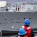 Sailors Hold Phone and Distance Line