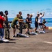 Sailors and Marines take part in a steel beach picnic