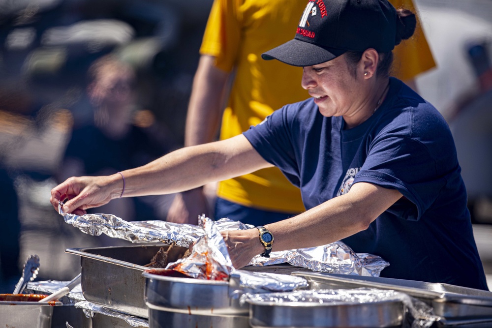 Sailors and Marines take part in a steel beach picnic