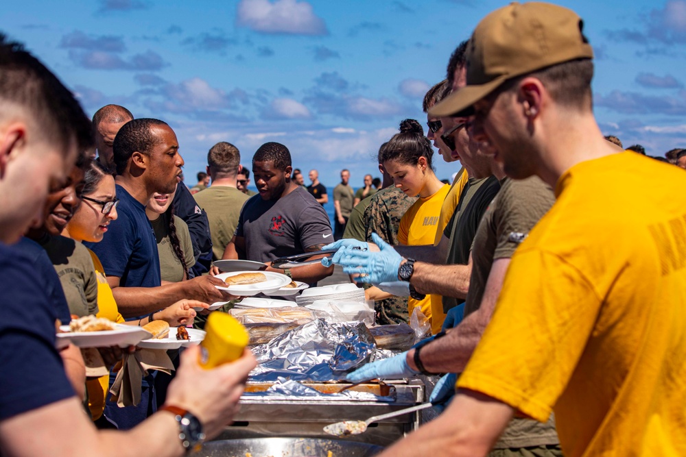 Sailors and Marines take part in a steel beach picnic