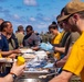 Sailors and Marines take part in a steel beach picnic