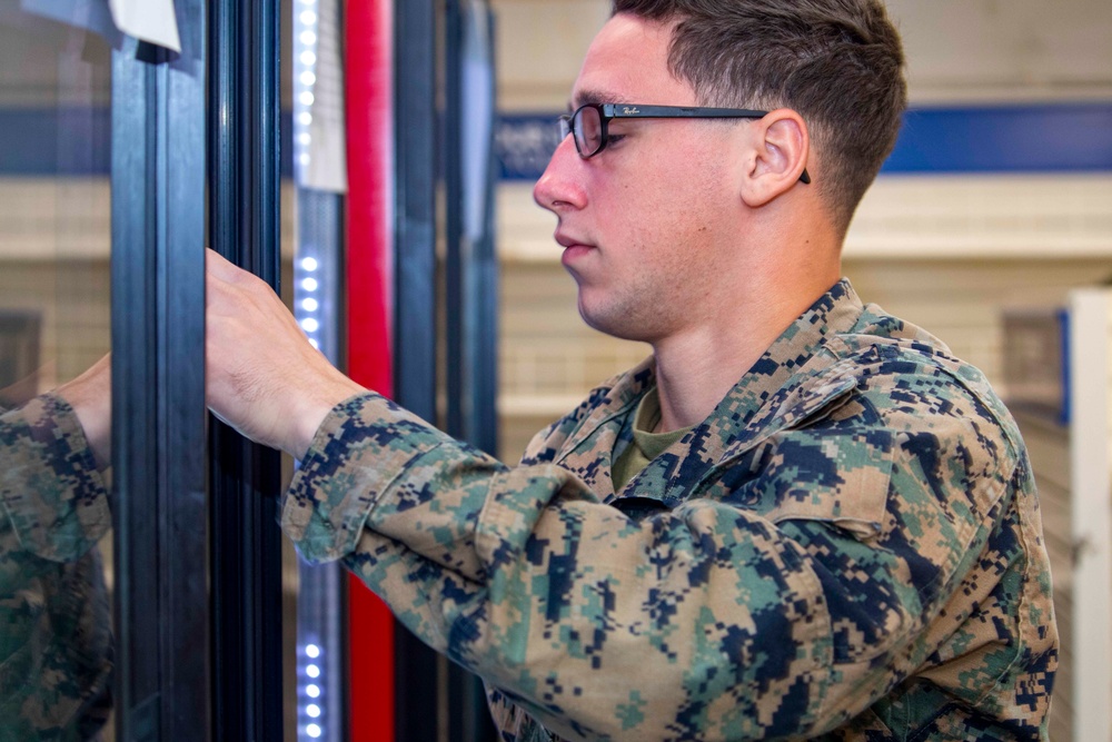 Sailors restock the ship store