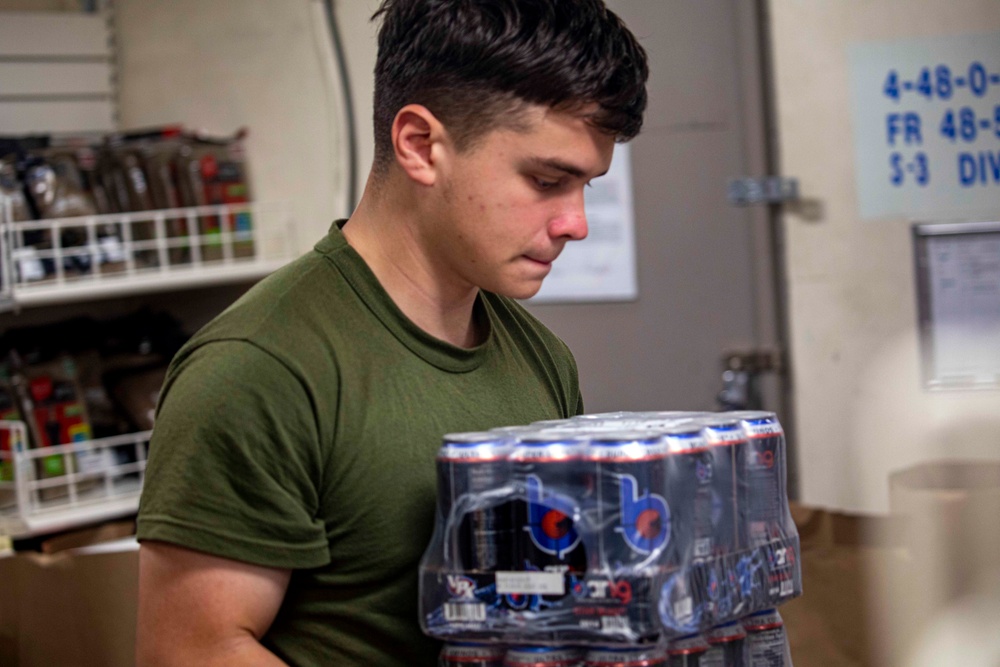 Sailors restock the ship store