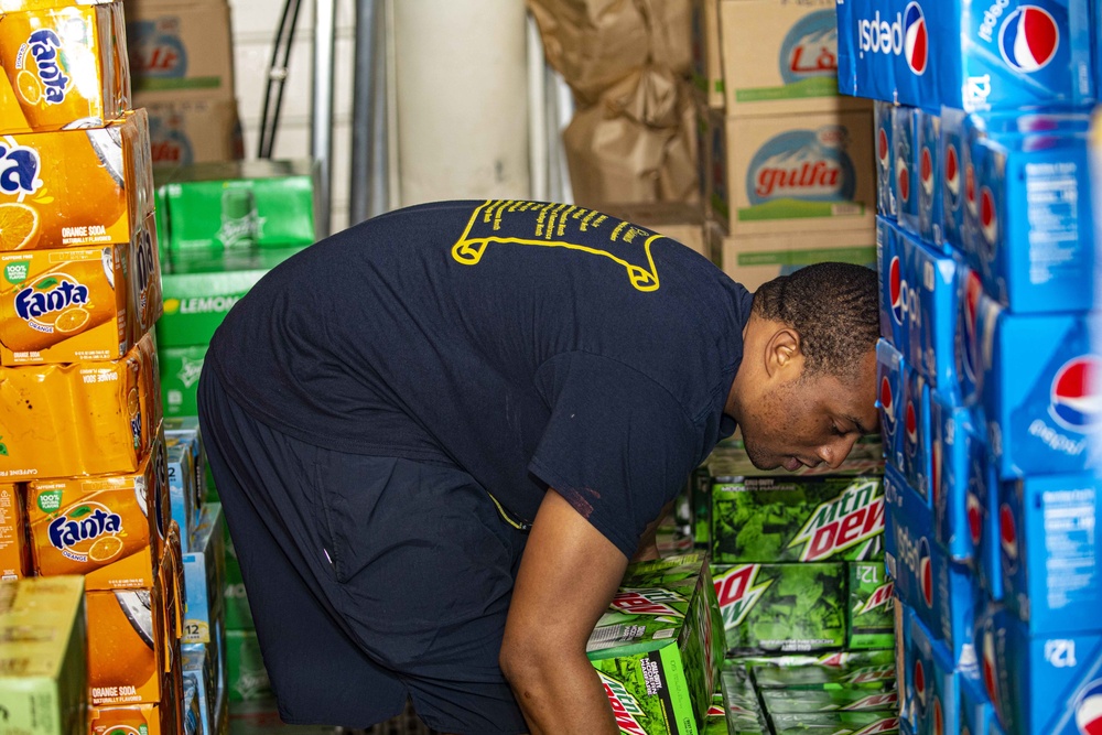 Sailors restock the ship store