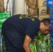 Sailors restock the ship store