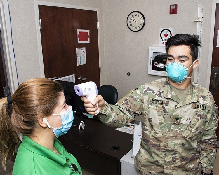 Soldiers at clinic stand in for civilians at home