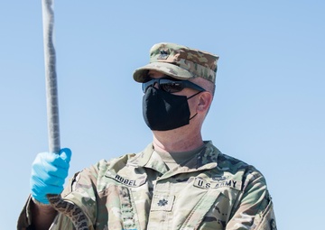 There’s a snake in my boot – Key military leaders assist with tagging and the study of rattlesnakes