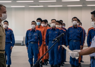 MCAS Iwakuni's Staff Sgt. York recieves a letter of appreciation from the city