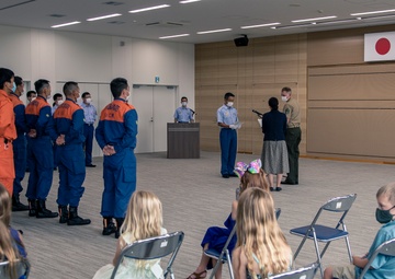 MCAS Iwakuni's Staff Sgt. York recieves a letter of appreciation from the city