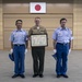 MCAS Iwakuni's Staff Sgt. York recieves a letter of appreciation from the city