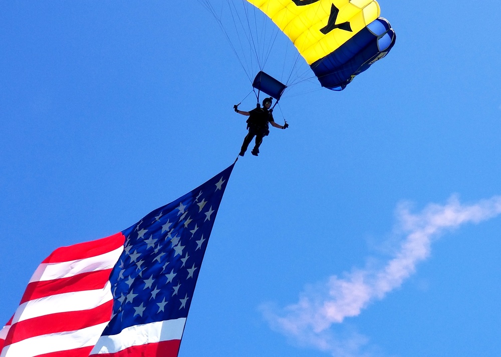Navy Parachute parades the U.S. Flag during Independence Day