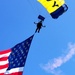Navy Parachute parades the U.S. Flag during Independence Day