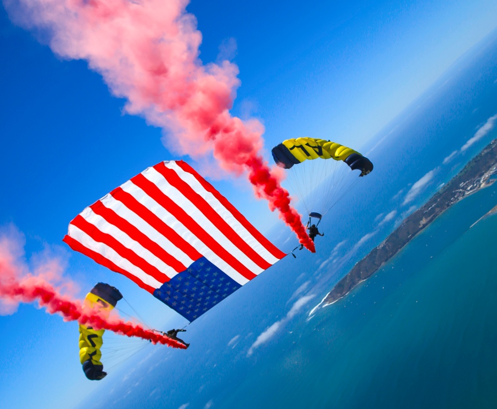 Navy Parachute Team performs a tethered flag routine during Independence Day