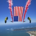 Navy Parachute Team performs a tethered flag routine during Independence Day