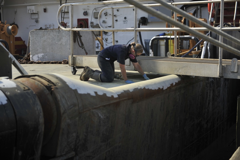 Inland Buoy Tender Frank Drew crew members work to maintain ship's readiness in Portsmouth, VA
