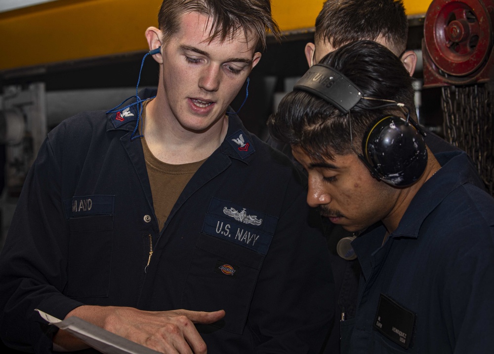 Sailors perform maintenance